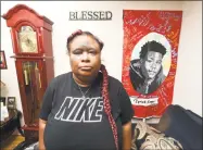  ?? Arnold Gold / Hearst Connecticu­t Media ?? Demethra Telford, mother of Tyrick Keyes, at her home in New Haven on July 3. Hanging on the wall at right is a picture of her son who was shot July 16, 2017, and died four days later.