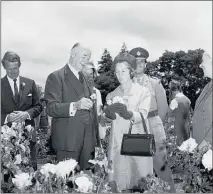  ??  ?? Rose Garden opening day in 1969: Sir Arthur and Lady Kathleen Porritt admiring Te Awamutu’s roses flanked by Keith Storey and Paddy Stephens.