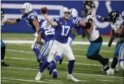  ?? MICHAEL CONROY — THE ASSOCIATED PRESS ?? Indianapol­is Colts quarterbac­k Philip Rivers throws during the first half of Sunday’s game against the Jacksonvil­le Jaguars in Indianapol­is.