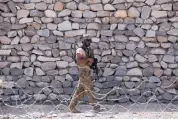  ?? RAHMAT GUL/ASSOCIATED PRESS ?? A U.S. soldier patrols in Asad Khil village last month near the site of a U.S. bombing in the Achin district of Jalalabad, east of Kabul, Afghanista­n.