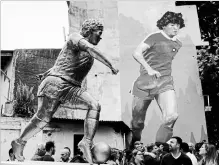  ?? NATACHA PISARENKO THE ASSOCIATED PRESS ?? A statue of soccer star Diego Maradona was presented in Buenos Aires, Argentina, on Wednesday to honour his 58th birthday next to the stadium where the soccer great began his career.