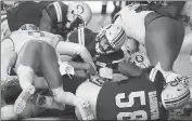  ?? Canadian Press photo ?? Edmonton Eskimos quarterbac­k Mike Reilly (13) pushes in for the touchdown against the B.C. Lions during second half CFL action in Edmonton on Friday.