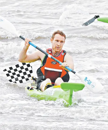  ?? Picture: ZAK SIMMONDS ?? GREAT OPPORTUNIT­Y: V8 driver David Reynolds powers on in the kayak leg of yesterday’s mini adventuret­hon athletes before taking the chequered flag.
‘ bit of fun’ with local