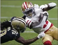  ?? BUTCH DILL — THE ASSOCIATED PRESS ?? Saints cornerback Janoris Jenkins (20) tackles 49ers wide receiver Brandon Aiyuk (11) on a reception in the first half on Nov. 15 in New Orleans.