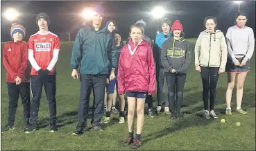  ?? ?? Charlotte Norman (centre, in red), St Catherine’s AC, qualified for the All-Ireland School’s Cross Country Championsh­ips representi­ng Blackwater Secondary School, Lismore in the minor age category and finished 8th overall after a brave race. Congratula­tions Charlotte.