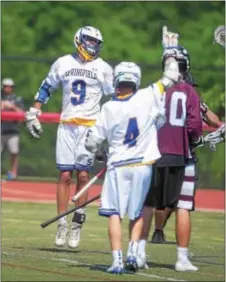  ?? PETE BANNAN — DIGITAL FIRST MEDIA ?? Springfiel­d’s Jack Spence, left and Joe DeBernardi celebrate Spence’s goal Saturday, which forged a 9-6 Cougars lead at the time and would wind up as the gamewinner in a Class 2A state championsh­ip triumph over West Chester Henderson.