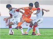  ?? Supplied photo ?? Al Jazira and Ajman players vie for the ball during their AGL match at the Rashid bin Saeed Stadium. —