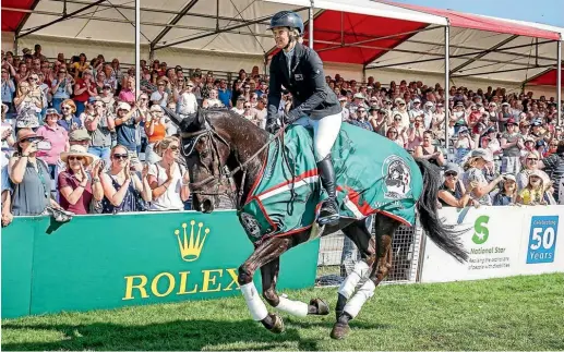  ?? PHOTOSPORT ?? Motueka’s Jonelle Price and her horse Classic Moet enjoy their victory lap at the Badminton Horse Trials. Price is the first woman to win the four-star, three-day event – described as the Wimbledon of the equestrian world – in 11 years.