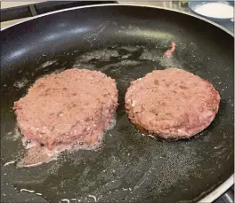  ?? JULIA RUBIN — THE ASSOCIATED PRESS ?? Patties of Beyond Burger, plant-based burgers, are prepared in Westcheste­r County, N.Y. on Jan. 10, 2022.