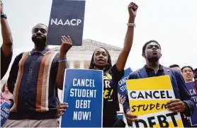  ?? Associated Press file photo ?? Students in Washington call for student loan relief last year. The latest such program by the Biden administra­tion would help more than 25 million borrowers.