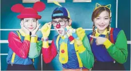  ?? BERNAMAPIC ?? From left: Nor Farah Hanim, Muhammad Al-Hazim and Nor Aina Natasya enjoy working as clowns despite the high cost of costumes.
–