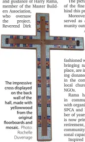  ?? Photo: Rochelle Duvenage ?? The impressive cross displayed on the back wall of the hall, made with yellowwood from the original floorboard­s and mosaic.