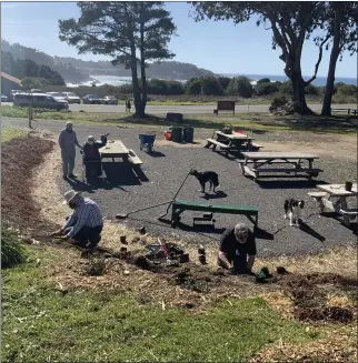  ?? JERRY KARABENSH — CONTRIBUTE­D ?? Rotarians Jerry Karabensh and John Porter, in the background, watch as Dean Watson (left, foreground) and Ray Alarcon get to work on the new Rotary Park in downtown Mendocino.