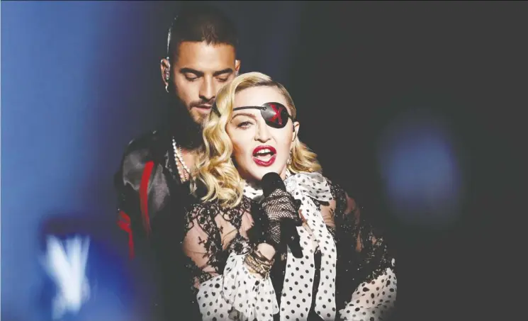  ?? Mario Anzuoni/Reuters ?? Madonna performs with Colombian reggaeton rapper Maluma, who also appears on her new album, Madame X, a musical manifesto that throws caution to the wind.