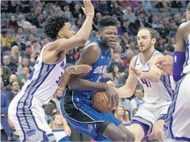  ?? RANDALL BENTON/AP ?? Magic center Mohamed Bamba, facing the Kings’ Marvin Bagley III last season, has added nearly 20 pounds to his 7-foot frame.