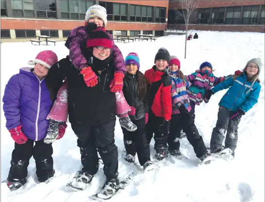  ?? MATTHEW MCCULLY ?? Teacher Rachel Bury with a group of SES students, out for a snowshoein­g adventure yesterday as part of the school’s carnival day activities.