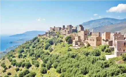  ?? RICK STEVES ?? In a far-off corner of the Peloponnes­e, clan wars left the hill town of Vathia in ruins.
