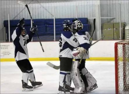  ?? DAVID M. JOHNSON - DJOHNSON@DIGITALFIR­STMEDIA.COM ?? Saratoga Springs players celebrate after a win against CBA-Syracuse/Jamesville-DeWitt during a varsity ice hockey game at Weibel Ave Ice Rink Dec. 2.