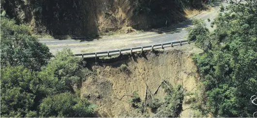  ?? WAKA KOTAHI ?? Cyclone Gabrielle caused extensive damage, including this underslip, on State Highway 1 at the Brynderwyn­s.