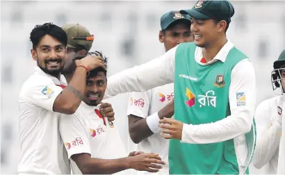  ?? Picture: Getty Images ?? LANDMARK MOMENT. Bangladesh­i players celebrate after their historic 20-run win over Australia in the first Test at Shere Bangla National Stadium in Mirpur yesterday.