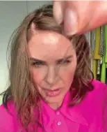  ??  ?? Stranded: Trinny Woodall holds hair
