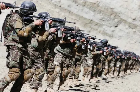  ?? Files/Reuters ?? The Afghan Special Forces during a military exercise. US envoy for Afghanista­n, Zalmay Khalilzad, urged Taliban to suspend attacks on government forces.