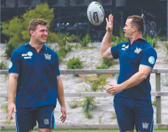  ?? Picture: MIKE BATTERHAM ?? Gold Coast’s new signings Jai Arrow (left) and Brenton Lawrence during their first day of training with the Titans.