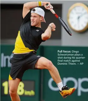  ?? — AP ?? Full focus: Diego Schwartzma­n plays a shot during his quarterfin­al match against Dominic Thiem.