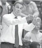  ?? JAMES CRISP/AP ?? Yahoo Sports obtained transcript­s of a wiretapped conversati­on between LSU coach Will Wade, above, and dealmaker Christian Dawkins.