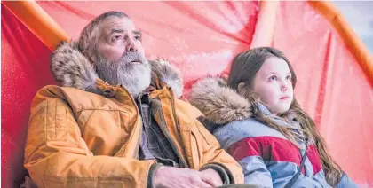  ?? Photo / Netflix via AP ?? George Clooney and Caoilinn Springall in a scene from The Midnight Sky.