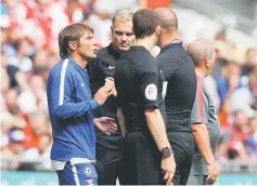  ??  ?? Chelsea manager Antonio Conte talks with referee Robert Madley. — Reuters photo