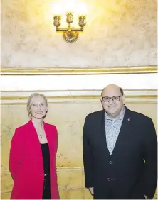  ?? COLE BURSTON, THE CANADIAN PRESS ?? Theatre producer Michael Rubinoff with Tim Hortons executive Hope Bagozzi at the Elgin Theatre in Toronto. Tim Hortons is set to take centre stage with a new theatrical production.