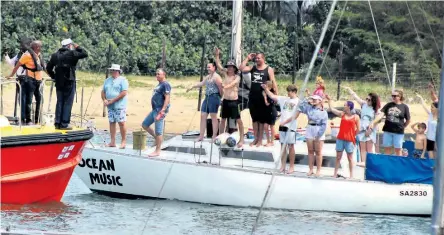  ?? ‘Ocean Music’ ?? Accompanie­d by City Speaker Tobias Gumede, ZYC commodore Kirsten Schreuder salutes to acknowledg­e the crew of the yacht