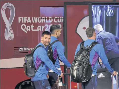  ?? AFP ?? Argentina forward Lionel Messi, left, and teammates arrive at the Hamad Internatio­nal Airport in Doha yesterday.