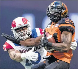  ?? CP PHOTO ?? Montreal Alouettes linebacker Henoc Muamba tackles B.C. Lions running back Jeremiah Johnson during a CFL game in Vancouver on June 16.