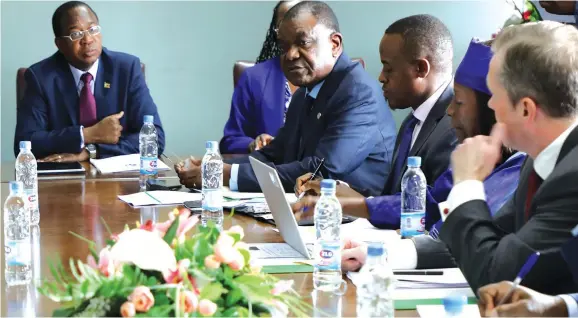  ?? Picture: Memory Mangombe ?? Finance and Economic Developmen­t Minister Mthuli Ncube (left) speaks during a meeting with the African Developmen­t Bank Group ( AfDB) delegation headed by the executive director Mbuyamu Matungulu (second from left) in Harare yesterday.