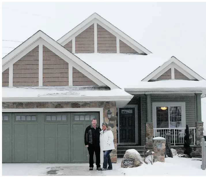  ?? Ed Kaiser/ Edmonton Journal ?? From left, Kenneth and Lory Dalueg built their home in Trumpeter by Big Lake because they could purchase a large lot at a reasonable price, for the bungalow they envisioned.