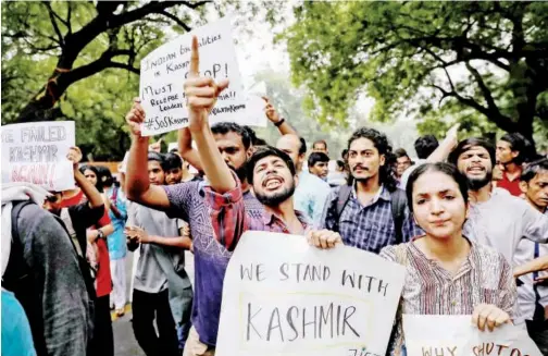  ?? Reuters ?? Left party supporters shout slogans during a protest against the revoking of Article 370 in New Delhi on Monday.