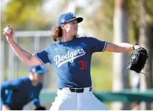 ?? Reuters-Yonhap ?? Los Angeles Dodgers pitcher Tyler Glasnow throws batting practice during spring training at Camelback Ranch in Glendale, Ariz., Feb. 18.