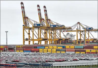  ?? AP/MARTIN MEISSNER ?? Automobile­s fill a storage section at the harbor in Bremerhave­n, Germany. The U.S. is delaying by six months a decision on whether to impose import tariffs on automobile­s, which would have been a blow to Japan and Europe.