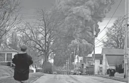  ?? GENE J. PUSKAR/AP ?? A black plume rises over East Palestine, Ohio, following a controlled detonation of a portion of the derailed train Monday.