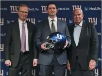  ?? FRANK FRANKLIN II - THE ASSOCIATED PRESS ?? New York Giants new NFL football head coach Joe Judge, center, poses for photograph­s with New York Giants chairman and executive vice president Steve Tisch, right, and New York Giants CEO John Mara after a news conference Thursday, Jan. 9, 2020, in East Rutherford, N.J.