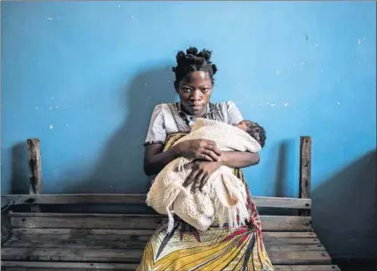  ?? Photo: Marco Longari/AFP ?? Risky: Infection control is now unofficial­ly in the hands of the patients at rural clinics in Malawi, because of budget restraints. Expectant women are instructed to bring plastic sheeting to cover the bed while they are giving birth, a razor blade to...