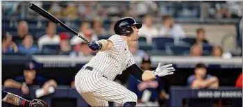  ?? Adam Hunger / Associated Press ?? New York’s Brett Gardner watches his sacrifice fly during the second inning of the team's game against the Boston Red Sox on Wednesday. He had one hit and one RBI on the night.