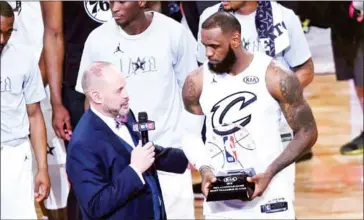  ?? JAYNE KAMIN-ONCEA/GETTY IMAGES/AFP ?? LeBron James accepts the MVP award after the 2018 NBA All-Star Game at Staples Center on Sunday in Los Angeles.