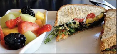  ?? Arkansas Democrat-Gazette/JENNIFER NIXON ?? Fruit and a Vegetable and Boursin Panini make a fresh and tasty lunch at 42 Bar and Table.