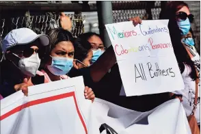  ?? Erik Trautmann / Hearst Connecticu­t Media ?? About 20 people gathered for a rally against Allen Fedor for claims of racially charged remarks on Tuesday outside his former body shop on Woodward Avenue in Norwalk.