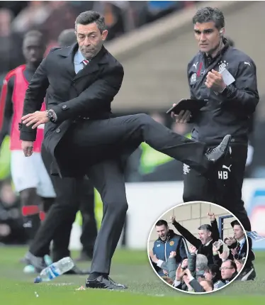  ??  ?? Angry: Rangers boss Pedro Caixinha kicks out at a water bottle, while (inset) Stephen Robinson celebrates Motherwell’s success from the stands following his dismissal