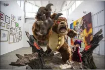  ?? ALLEN J. SCHABEN — LOS ANGELES TIMES ?? Annie and Tibbers: Statue of characters from the League of Legends game, in the new headquarte­rs of Riot Games in Los Angeles.