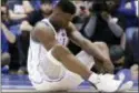  ?? GERRY BROOME — ASSOCIATED PRESS ?? Duke’s Zion Williamson sits on the floor following an injury against North Carolina, in Durham, N.C., Wednesday.